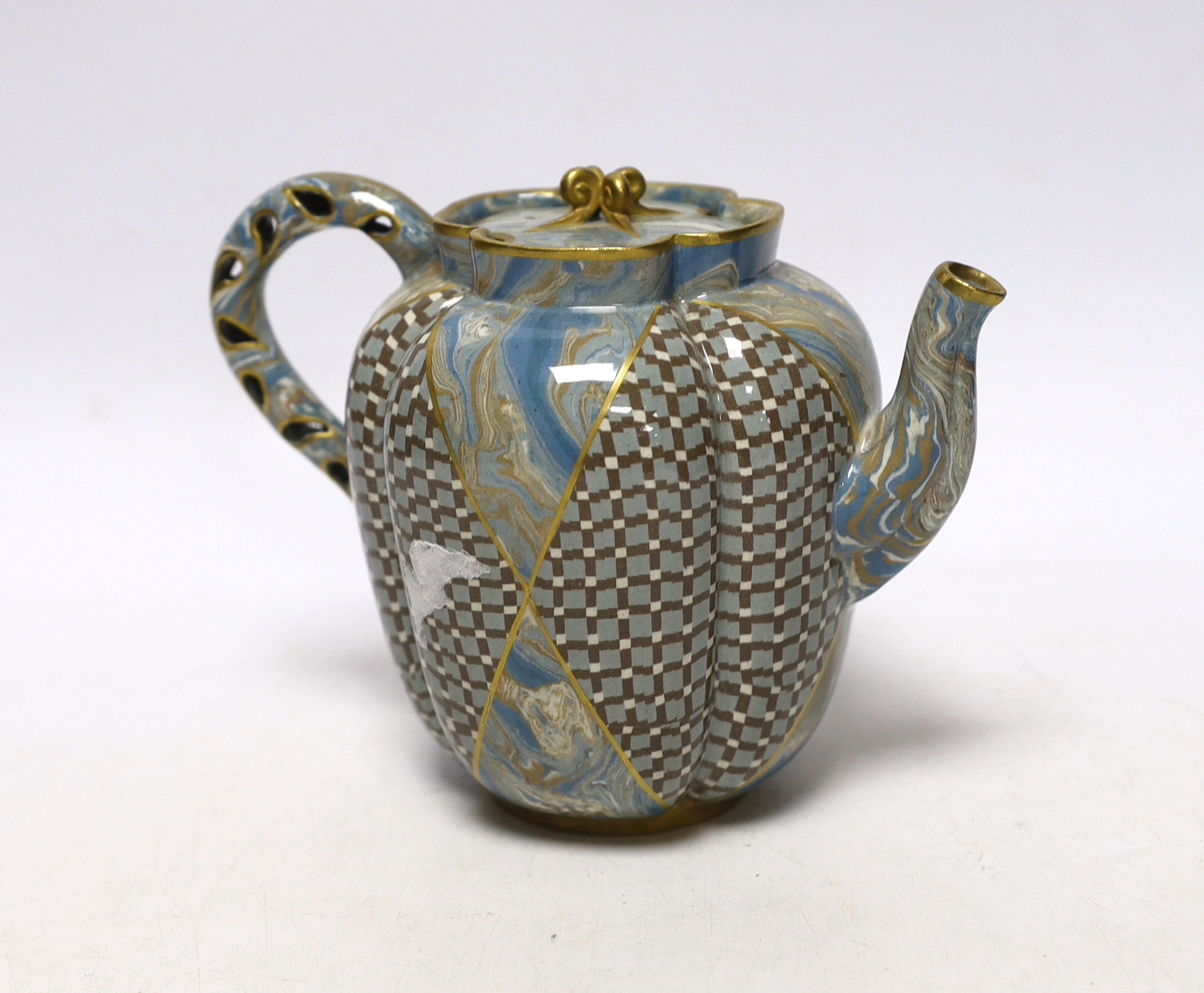 A good Doulton & Rix's patent Marqueterie ware teapot, c.1887, of quatrelobed form with 'teardrop' pierced handle, alternating panels of lattice and marbling, black printed mark and inscribed in black 646B, 16.5cm wide